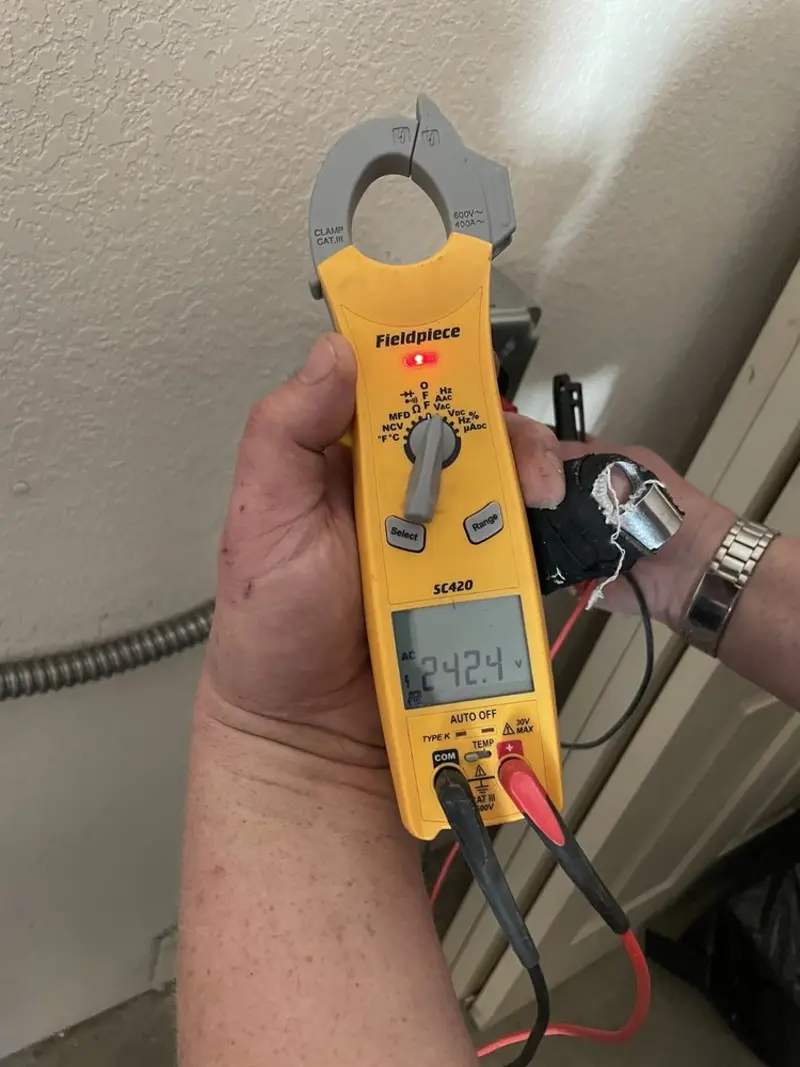 Voltage testing with clamp meter during Recessed Lighting Installation in Liberty Hill